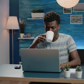Freelance employee working from home on laptop