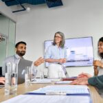 Diverse business leaders and professionals collaborating in a modern office meeting