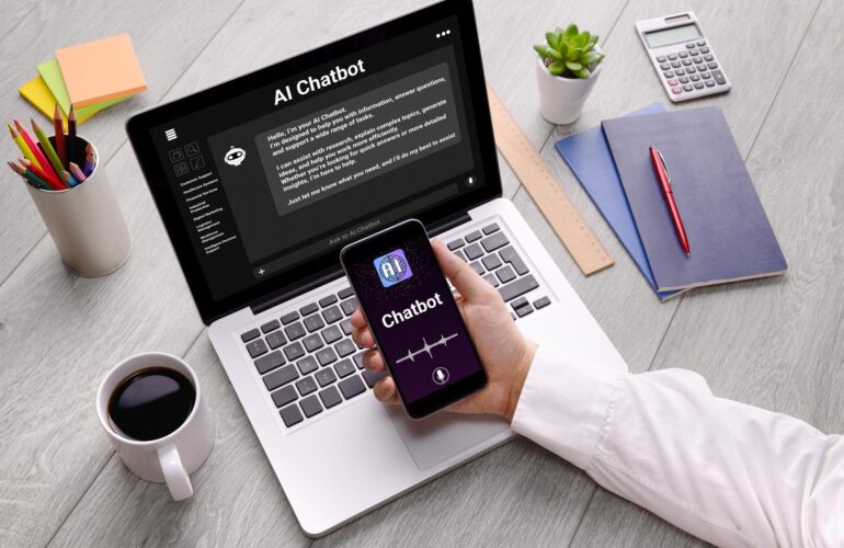 Professional employee using AI chatbot technology on a laptop in a modern office workspace