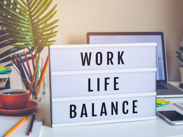Work Life Balance concepts with text on light box on desk table - Career Image Solutions
